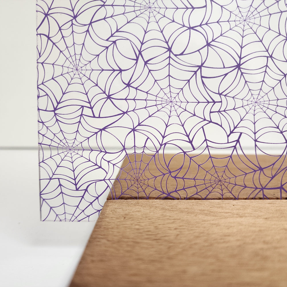 PatternPly® Scattered Purple Spiderwebs Mini sheet showing the pattern