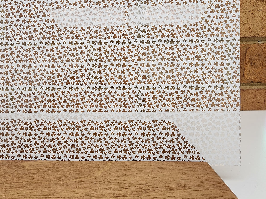 PatternPly® Scattered Micro Shamrocks WHITE sheet showing the pattern