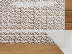 PatternPly® Scattered Micro Shamrocks WHITE sheet showing the pattern