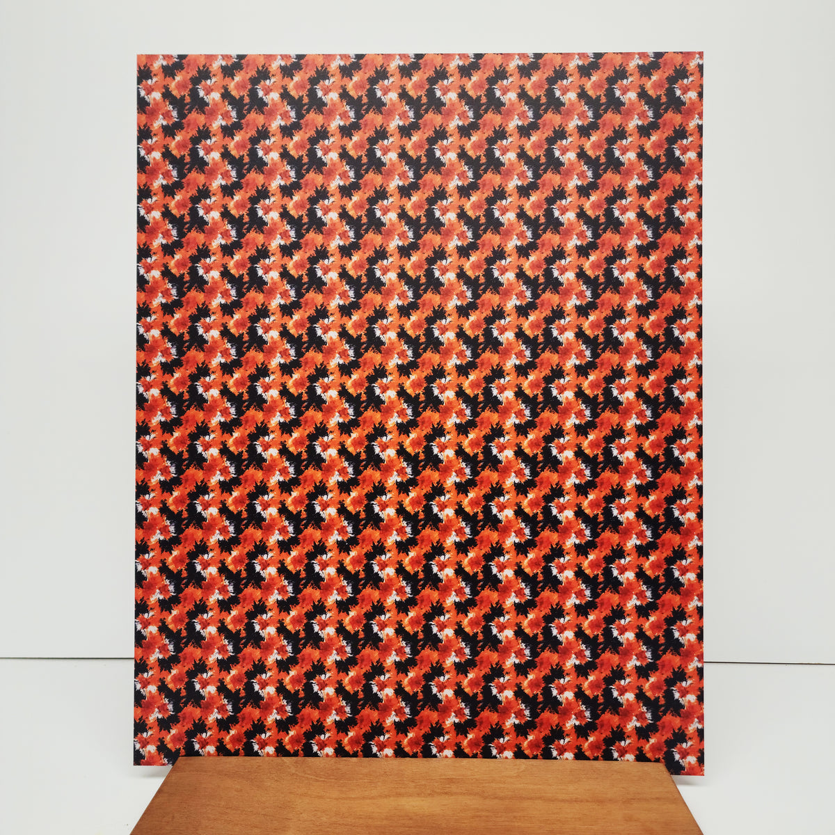 PatternPly® 19x24" Black and Orange Tie Dye Original Scale sheet showing the pattern