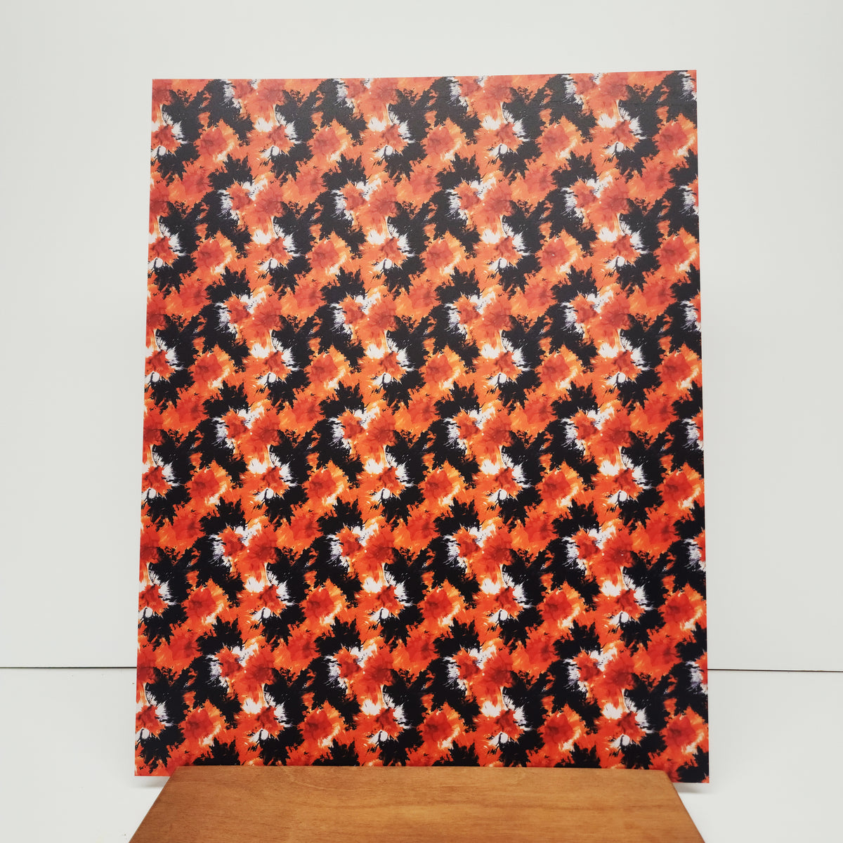 PatternPly® 19x24" Black and Orange Tie Dye XL Scale sheet showing the pattern