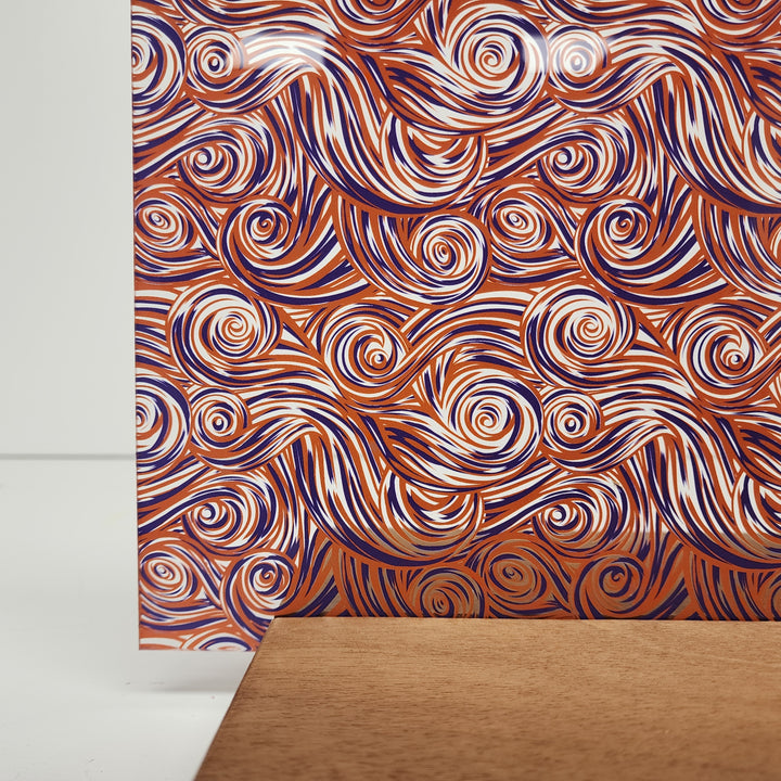 PatternPly® Scattered Purple and Orange Swirls