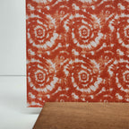 PatternPly® Full Coverage Orange and White Tie Dye sheet showing the pattern