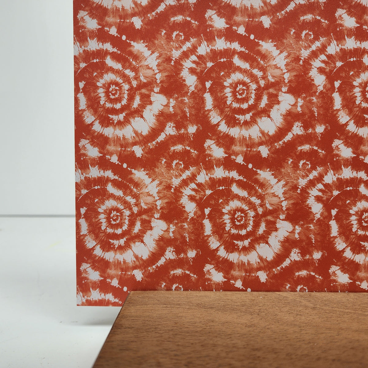 PatternPly® Full Coverage Orange and White Tie Dye sheet showing the pattern