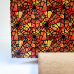 PatternPly® Full Coverage Orange Stained Glass Spiderwebs sheet showing the pattern