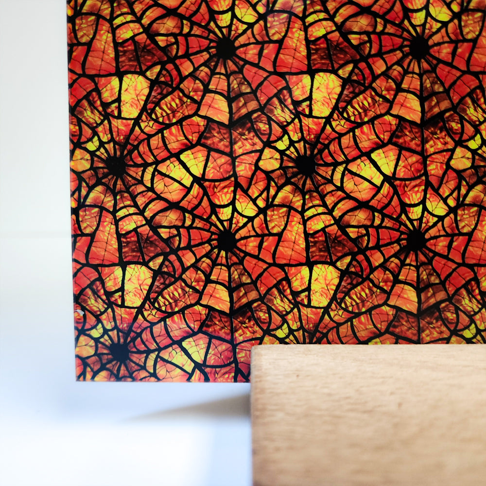 PatternPly® Full Coverage Orange Stained Glass Spiderwebs sheet showing the pattern