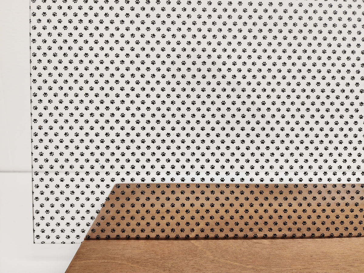 PatternPly® Scattered Micro School Pawprints BLACK sheet showing the pattern