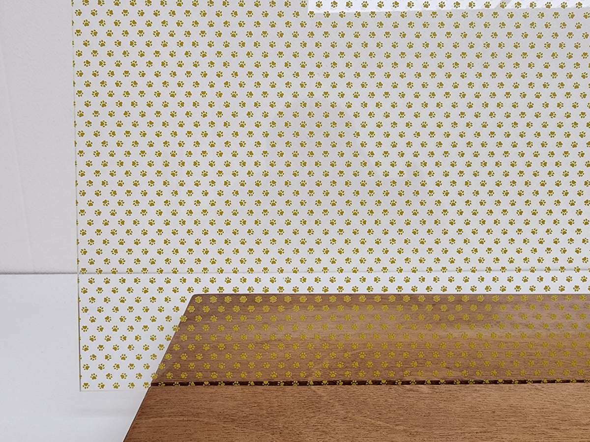 PatternPly® Scattered Micro School Pawprints GOLD sheet showing the pattern