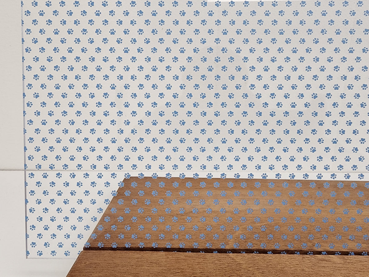 PatternPly® Scattered Micro School Pawprints LIGHT BLUE sheet showing the pattern