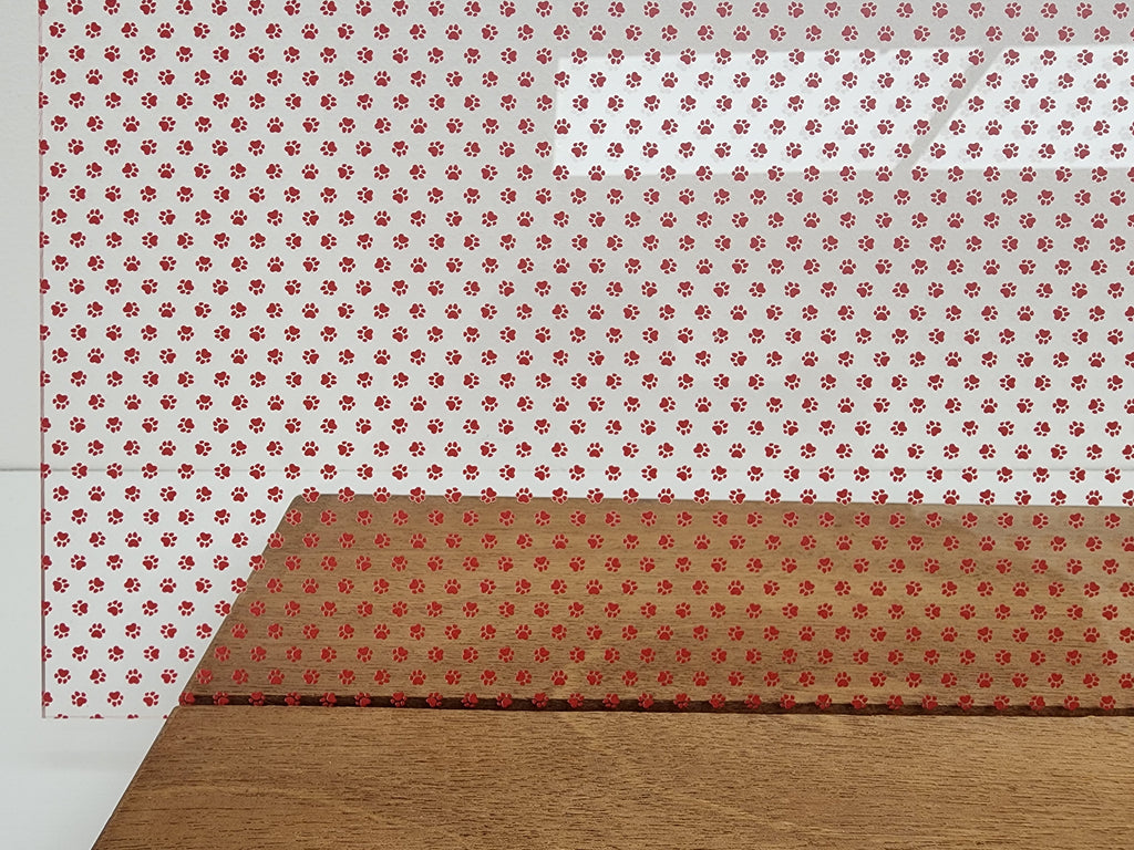 PatternPly® Scattered Micro School Pawprints RED sheet showing the pattern