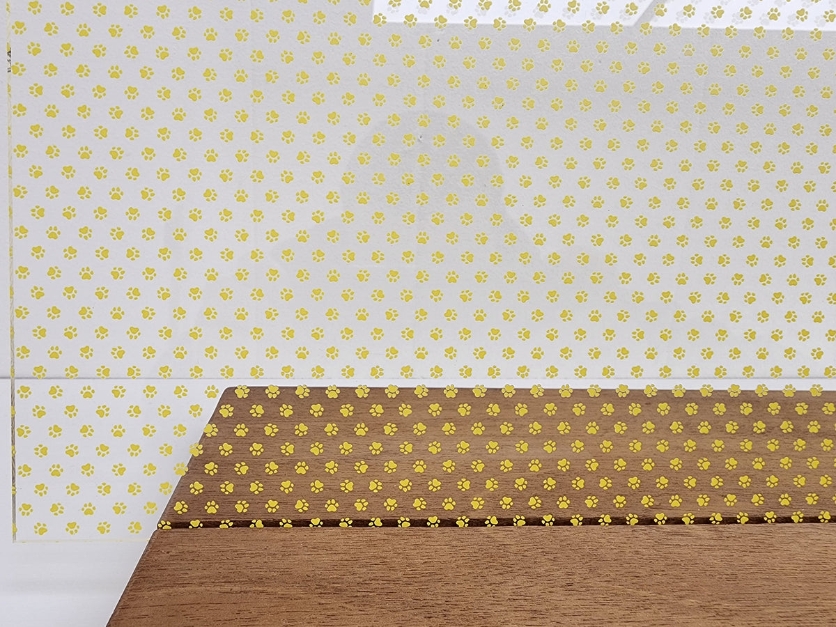 PatternPly® Scattered Micro School Pawprints YELLOW sheet showing the pattern