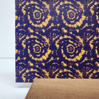 PatternPly® Full Coverage Purple and Gold Tie Dye sheet showing the pattern
