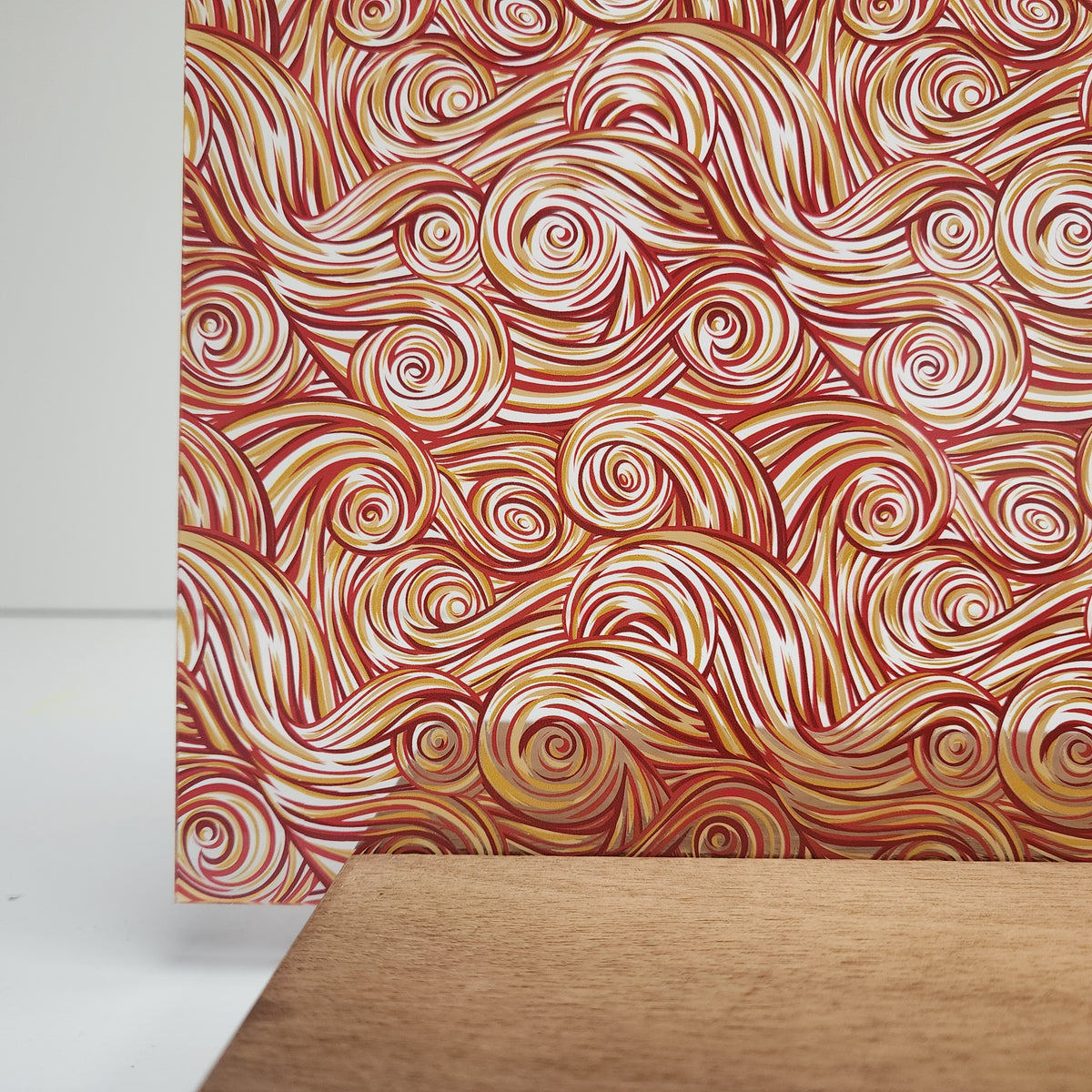 PatternPly® Scattered Red and Yellow Swirls sheet showing the pattern