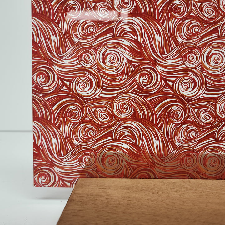 PatternPly® Scattered Red and Orange Swirls