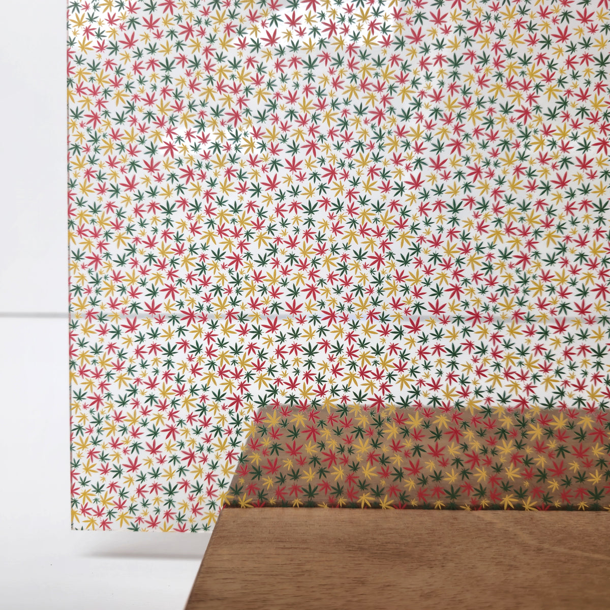 PatternPly® Scattered Micro Red, Yellow, Green Marijuana Leaves sheet showing the pattern