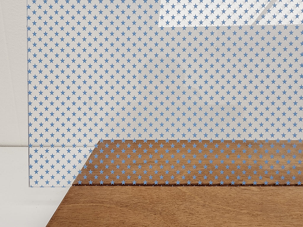 PatternPly® Scattered School Stars LIGHT BLUE sheet showing the pattern