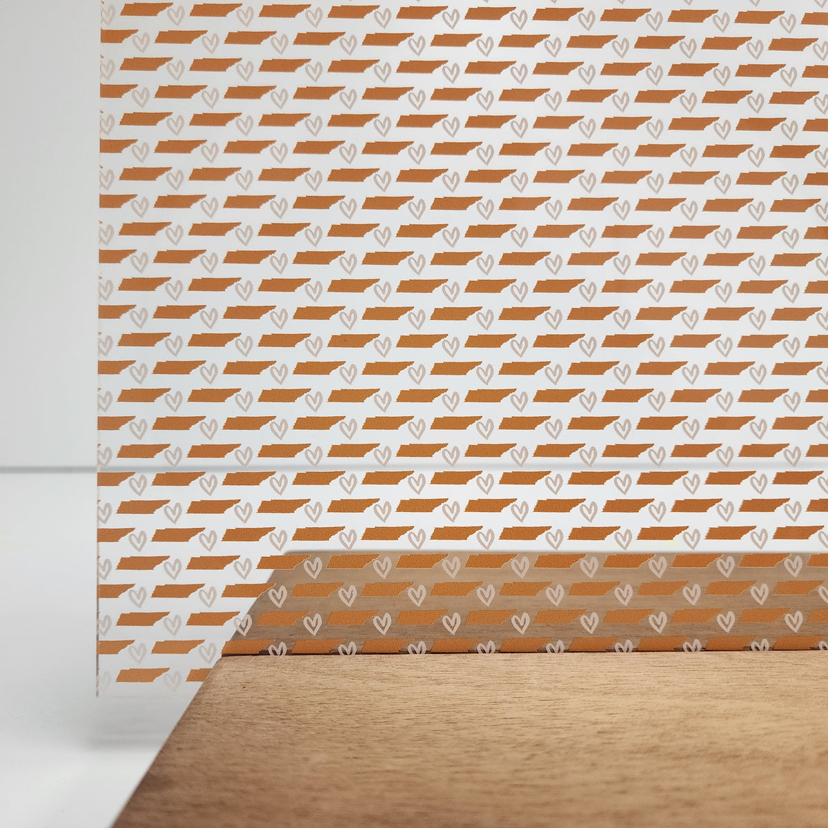 PatternPly® Scattered Tennessee Orange and White sheet showing the pattern