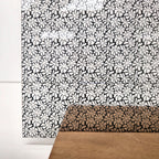 PatternPly® Scattered Wavy Flowers Black sheet showing the pattern