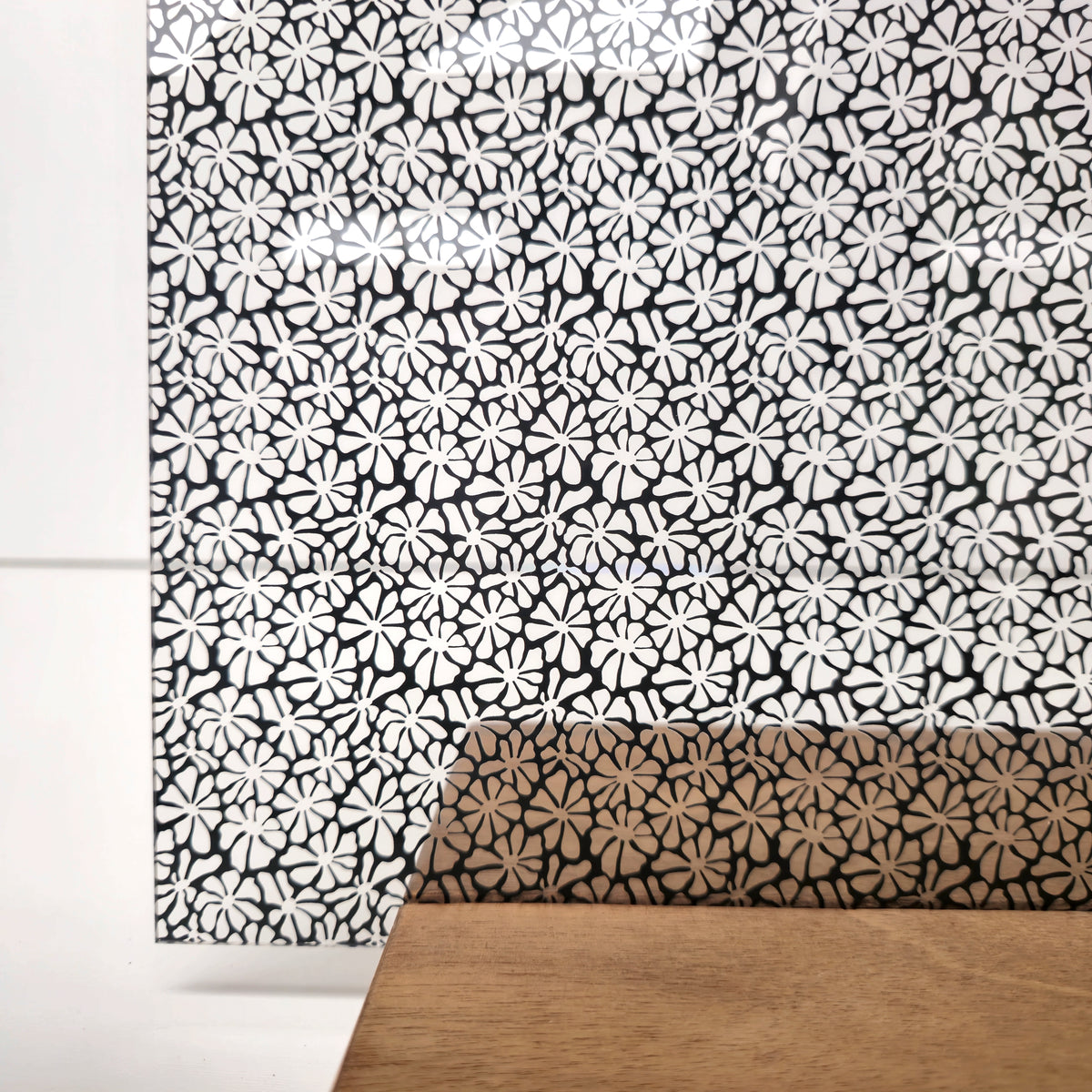 PatternPly® Scattered Wavy Flowers Black sheet showing the pattern