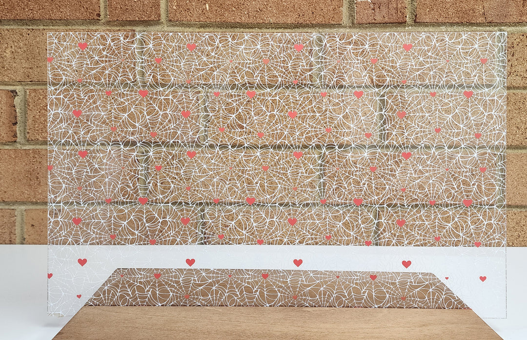 PatternPly® Scattered White Spiderwebs with Red Hearts