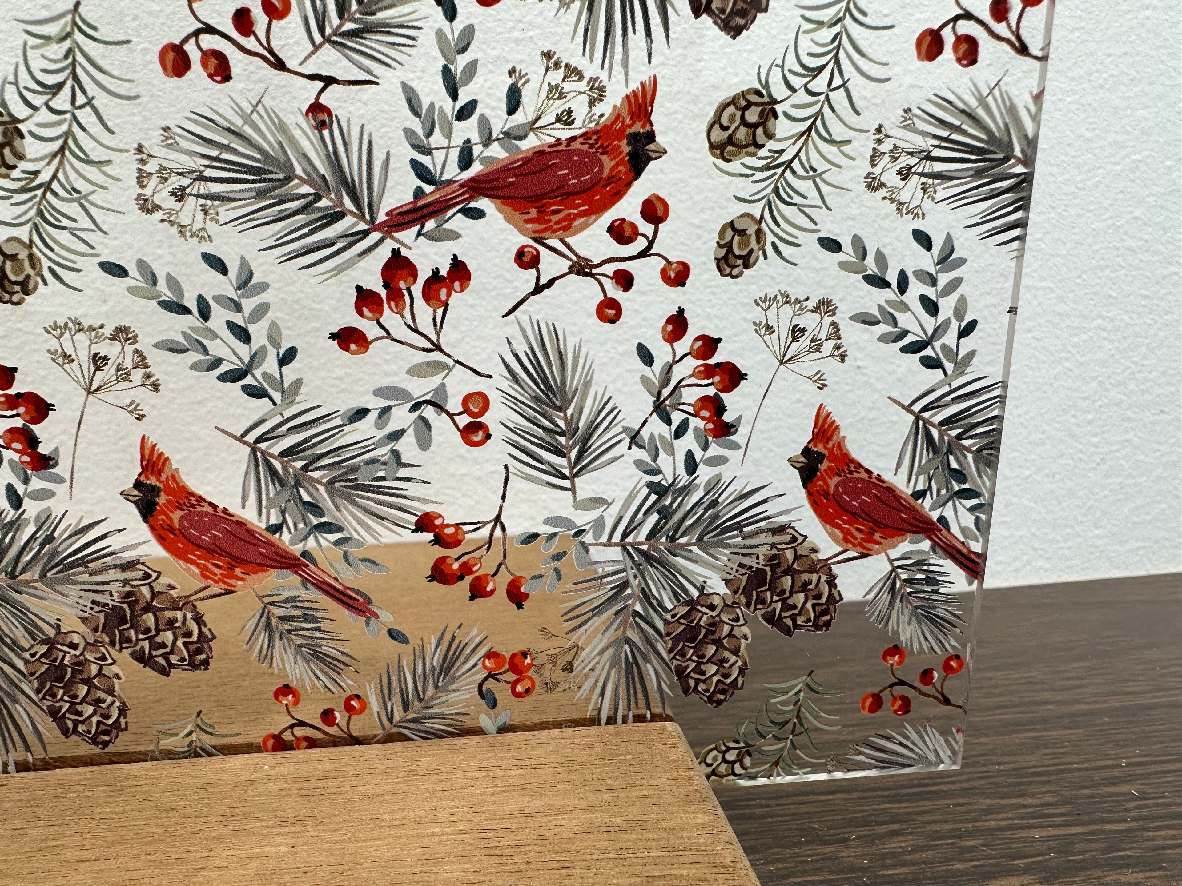 PatternPly® Scattered Cardinals and Pinecones Large sheet showing the pattern