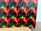 PatternPly® Full Coverage Green, Yellow, and Red Christmas Galaxy sheet showing the pattern
