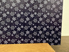 PatternPly® Full Coverage Navy and White Snowflake Swirls sheet showing the pattern