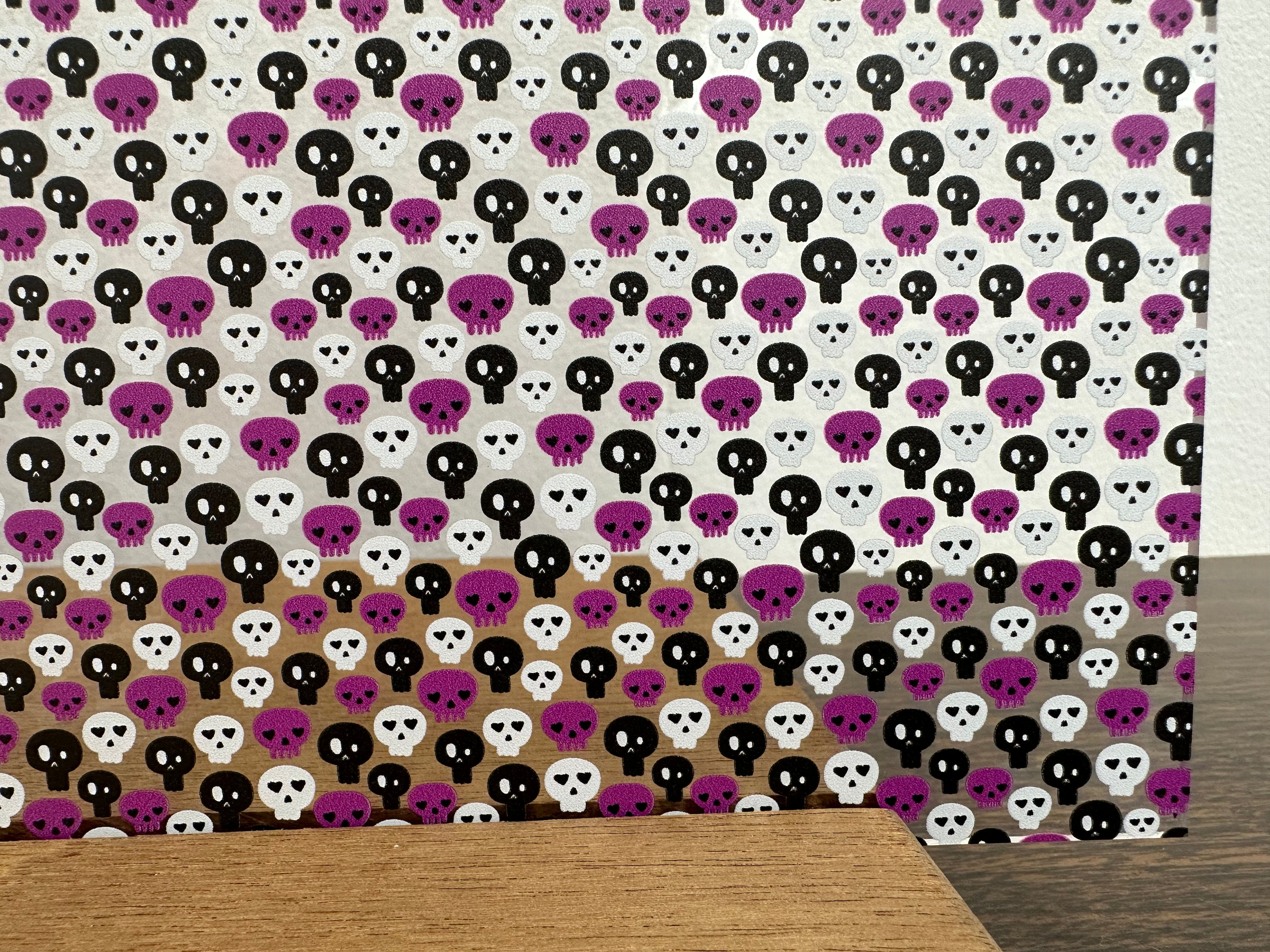 PatternPly® Scattered Purple, Black, and White Skulls sheet showing the pattern
