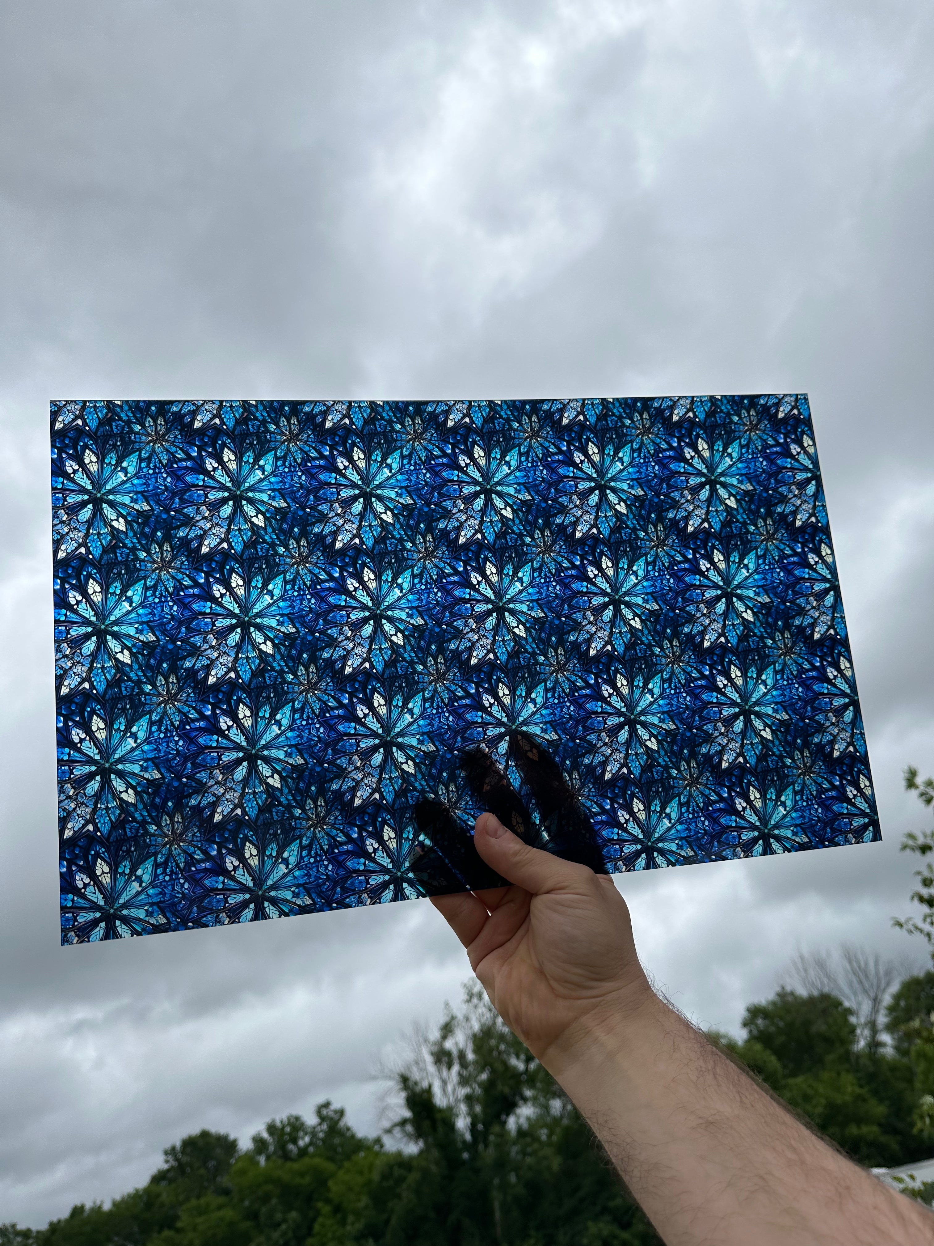 PatternPly® Transparent Blue Stained Glass Snowflakes sheet showing the pattern