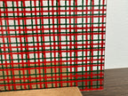 PatternPly® Scattered Red and Green Plaid sheet showing the pattern