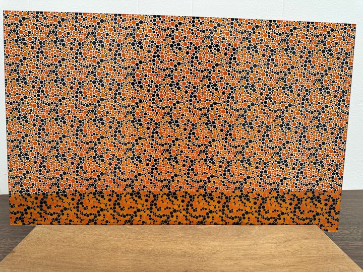 PatternPly® Scattered Orange and Black Bubbles