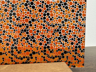 PatternPly® Scattered Orange and Black Bubbles