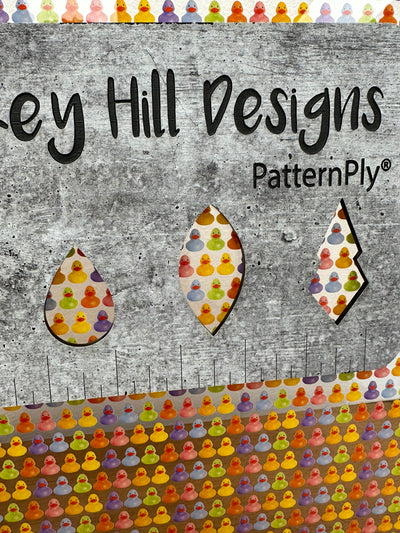 PatternPly® Scattered Rainbow Rubber Ducks