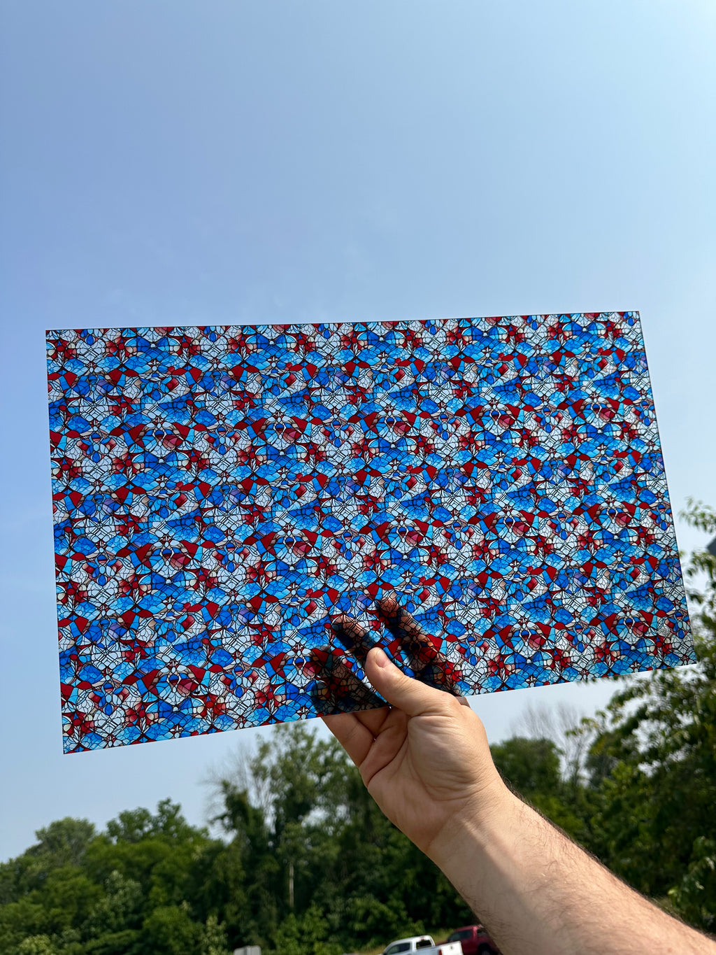 PatternPly® Transparent Red, White, and Blue Stained Glass sheet showing the pattern