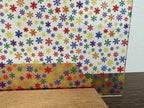PatternPly® Scattered Micro Rainbow Snowflakes sheet showing the pattern
