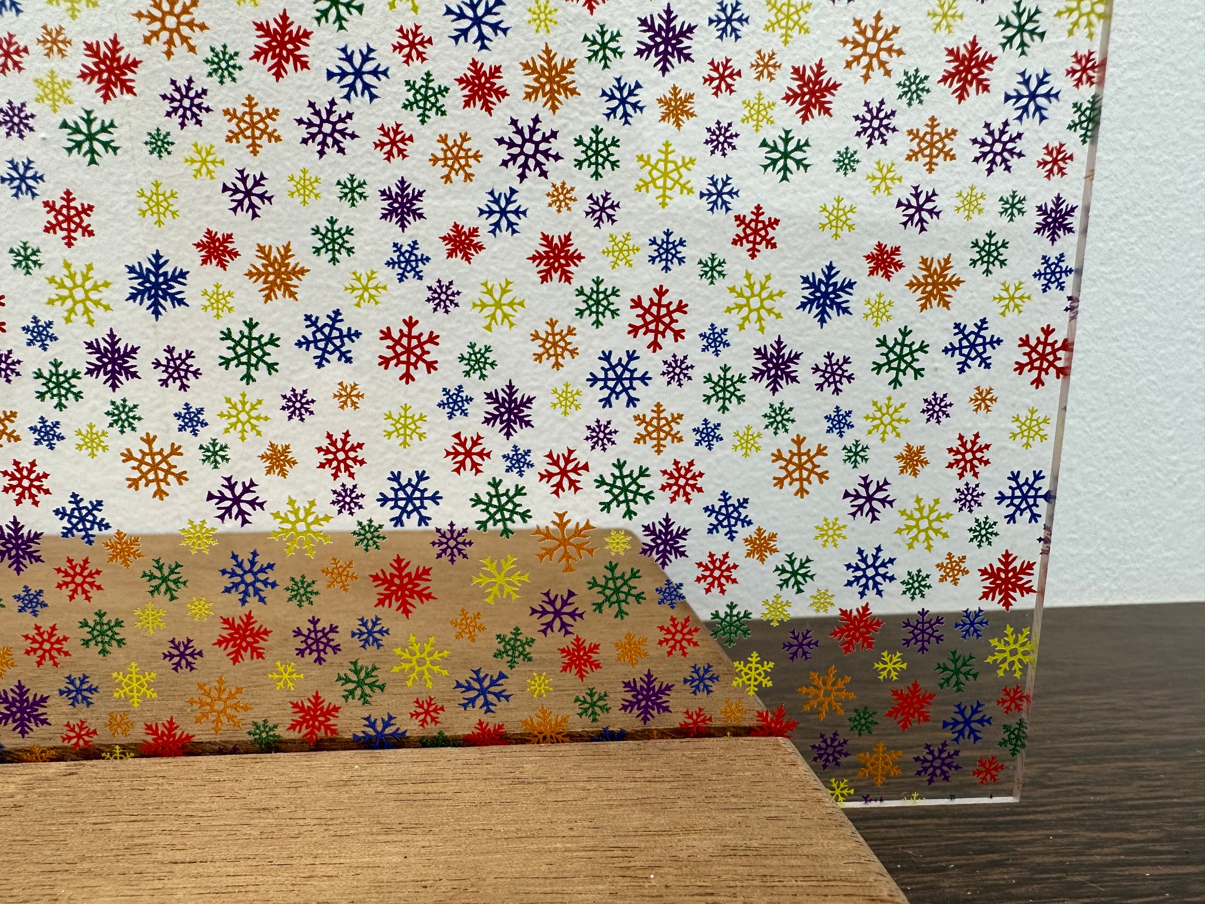 PatternPly® Scattered Micro Rainbow Snowflakes sheet showing the pattern