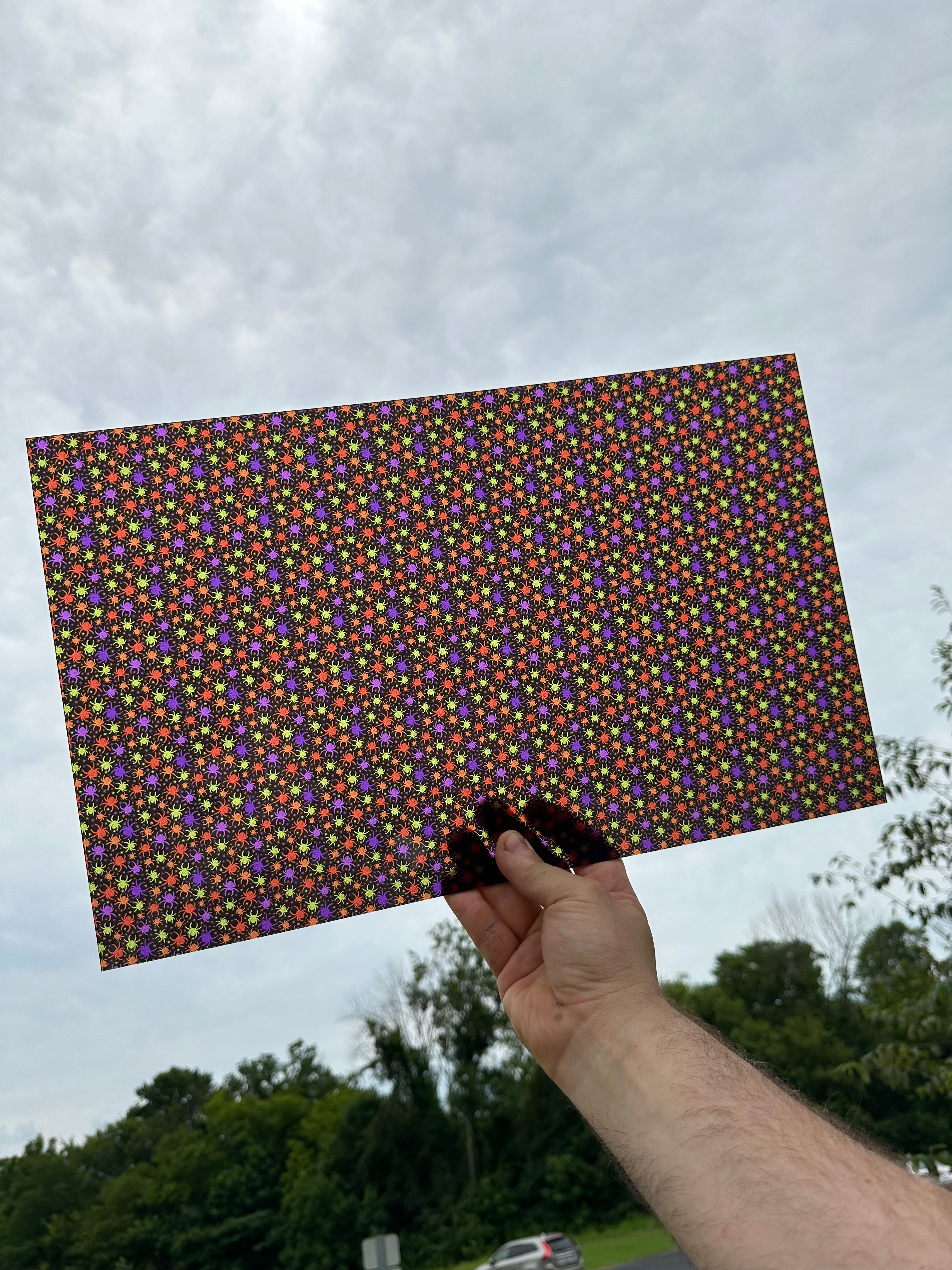 PatternPly® Transparent Colorful Spiders sheet showing the pattern