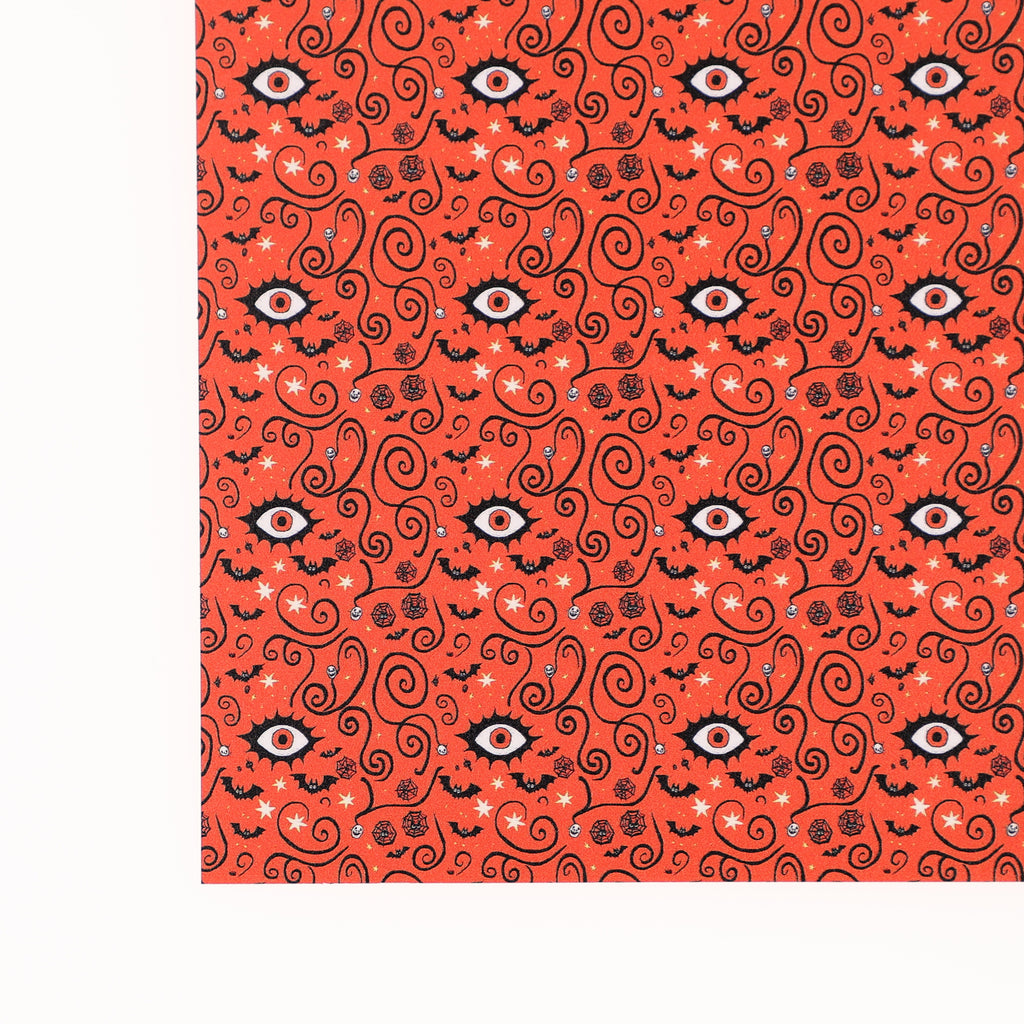 PatternPly® Full Coverage Orange Eyeball Swirls sheet showing the pattern