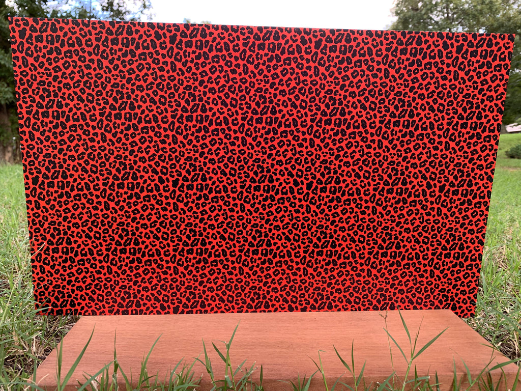 PatternPly® Full Coverage Orange and Black Leopard sheet showing the pattern