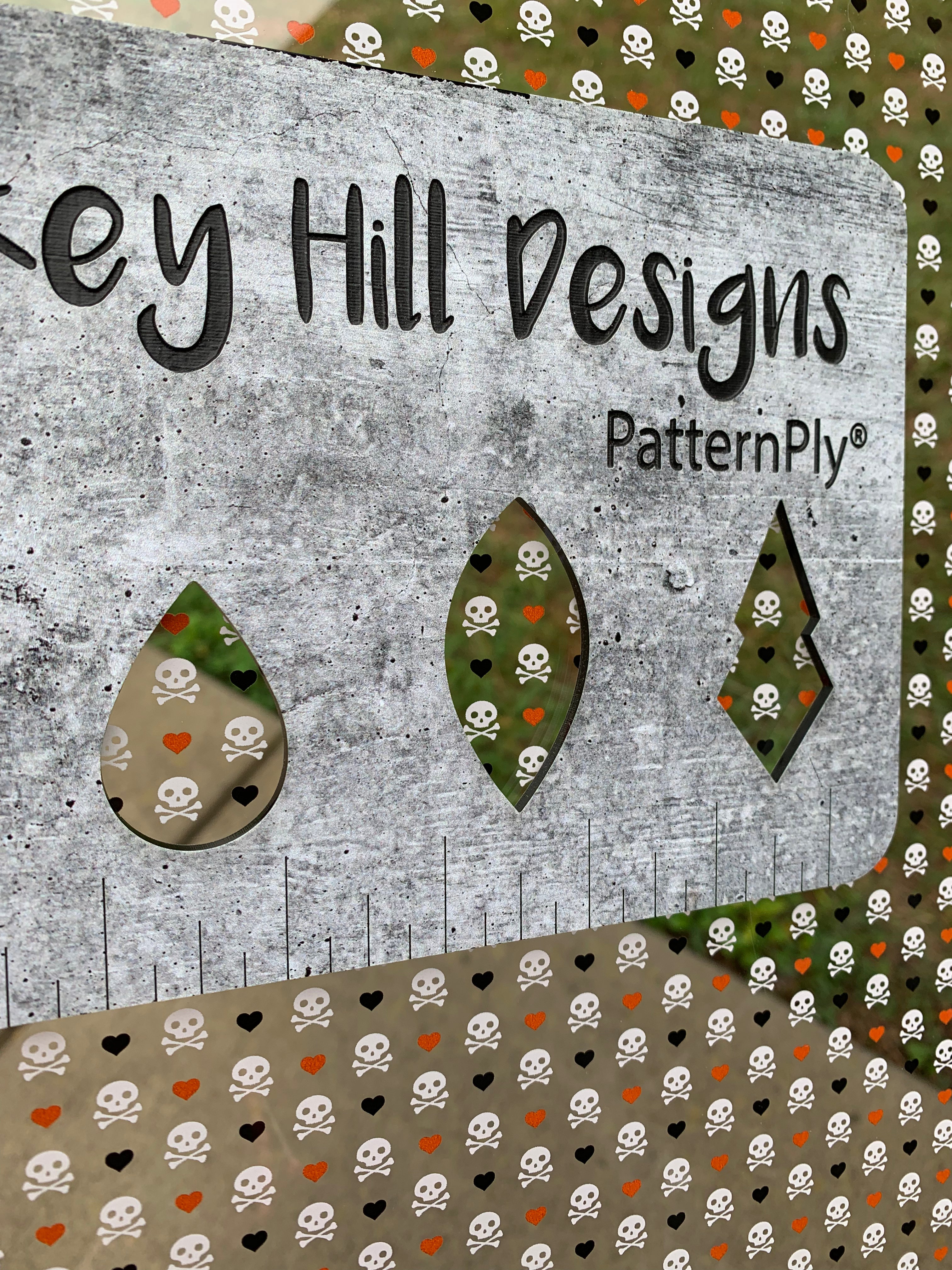 PatternPly® Scattered Skulls and Orange/Black Hearts sheet showing the pattern