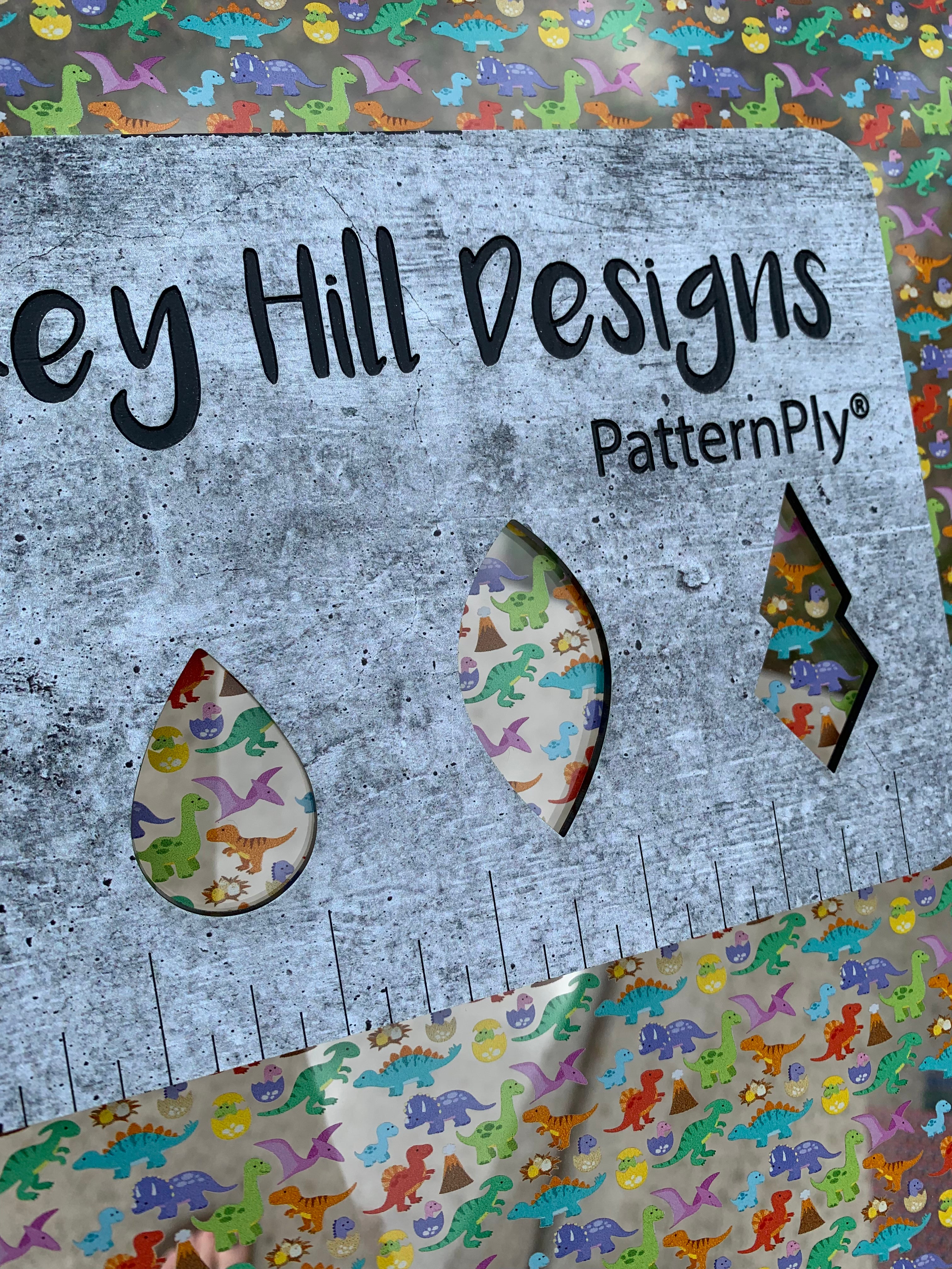 PatternPly® Scattered Colorful Dinosaurs sheet showing the pattern