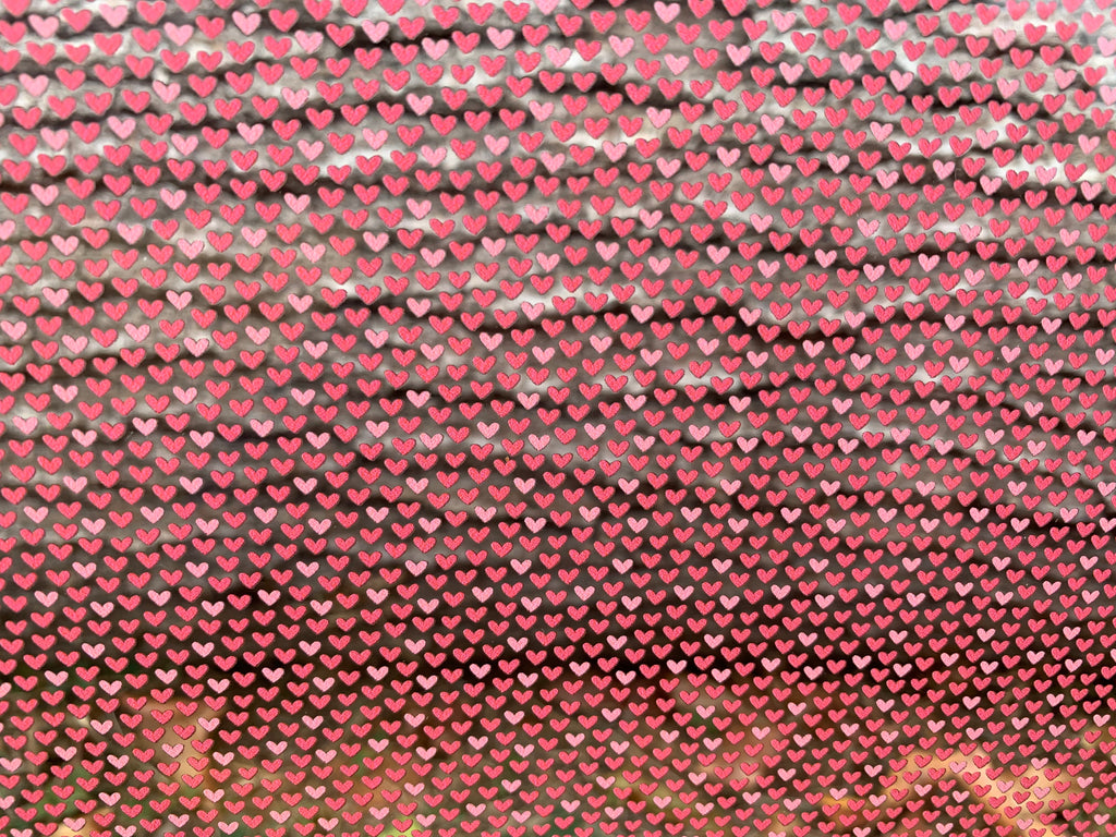 PatternPly® Scattered Micro Pink Hearts sheet showing the pattern