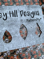 PatternPly® Scattered Bats, Skulls, and Jack o' Lanterns sheet showing the pattern
