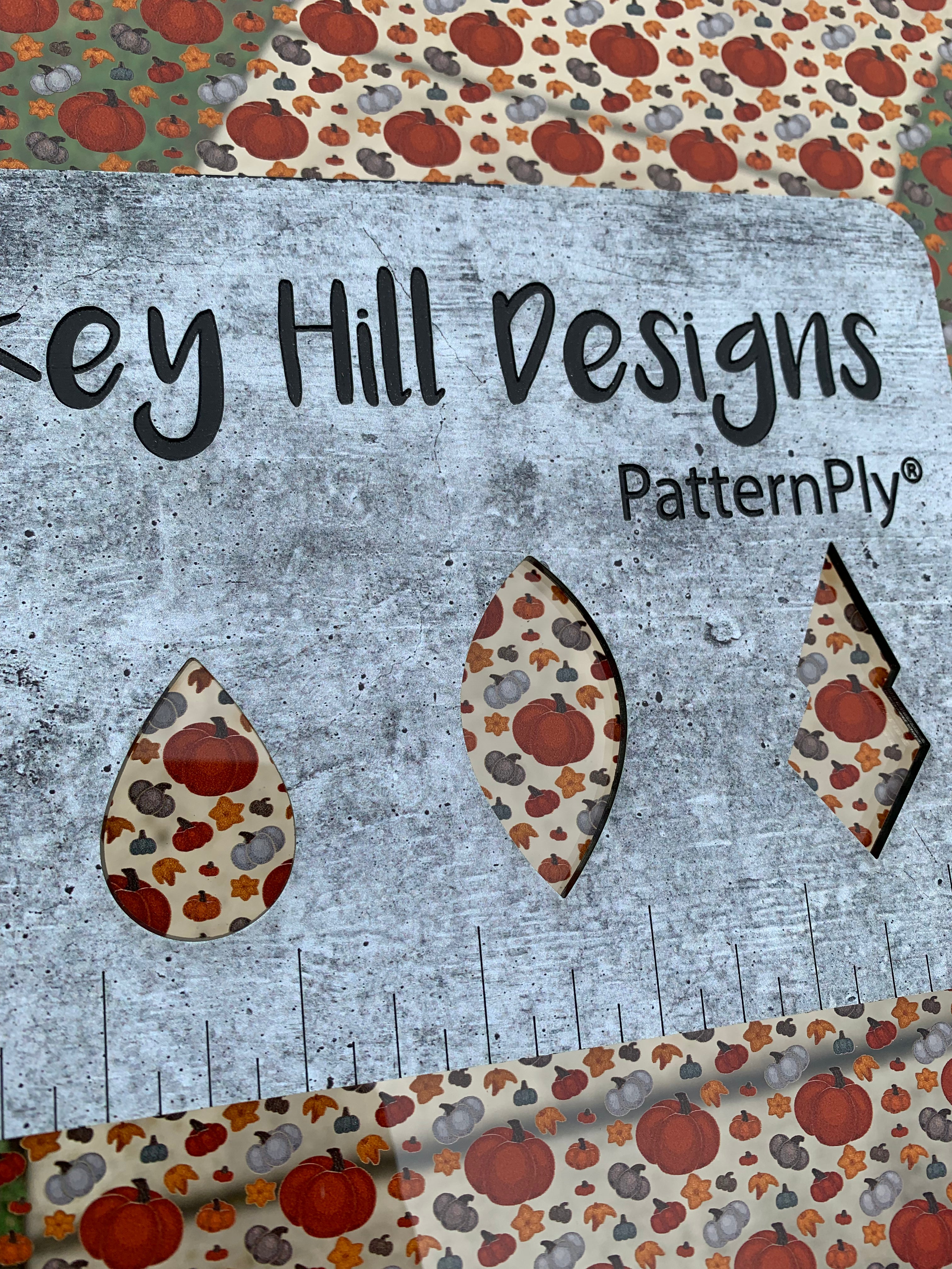 PatternPly® Scattered Gray and Orange Pumpkins sheet showing the pattern