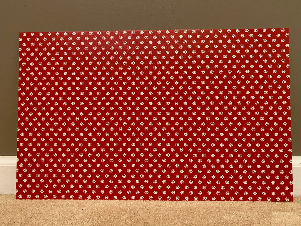 PatternPly® Full Coverage Red and White Paw Prints sheet showing the pattern