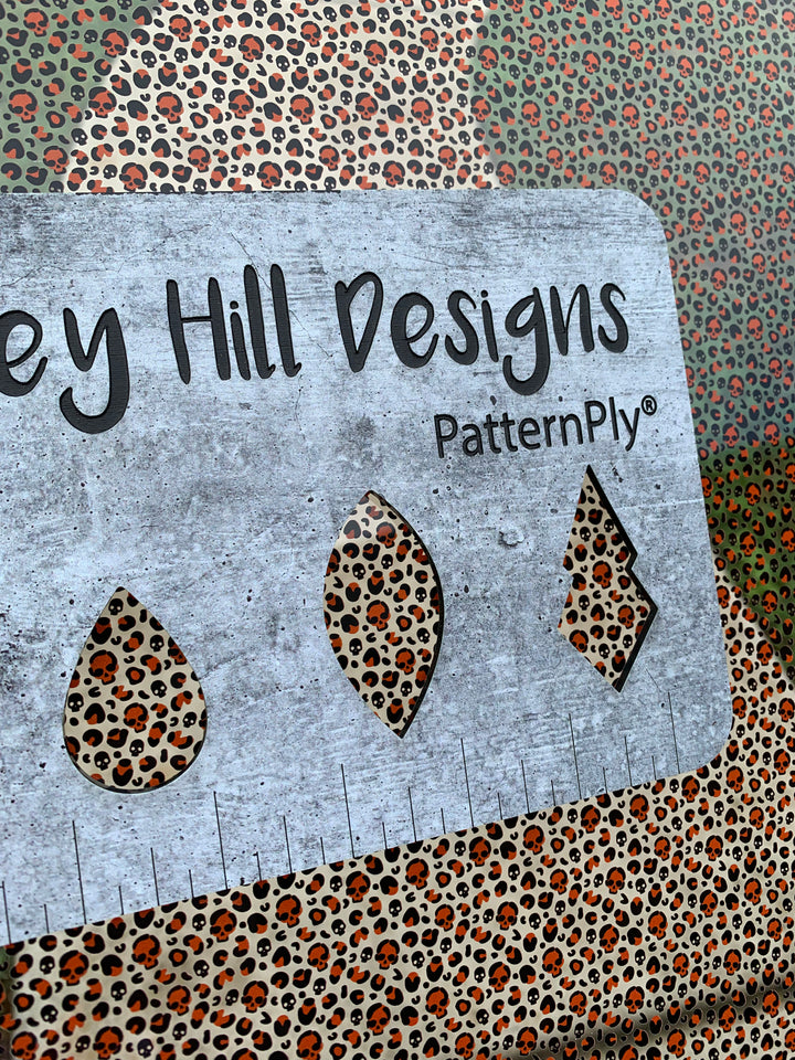 PatternPly® Scattered Orange Micro Skull Leopard