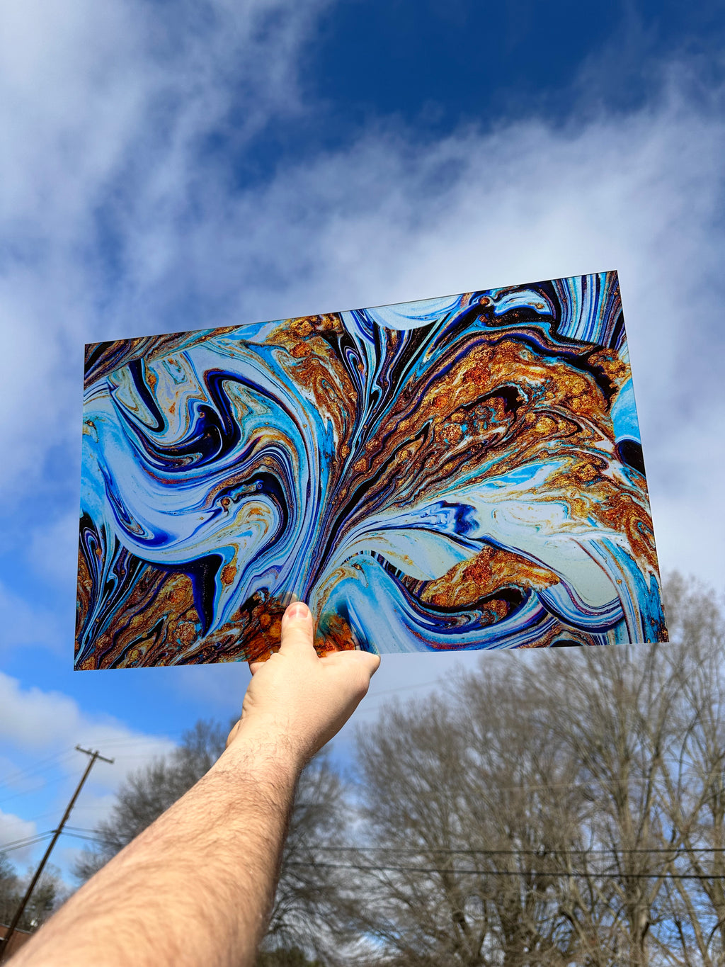 PatternPly® Transparent Blue and Gold Glitter* Paint Swirl sheet showing the pattern