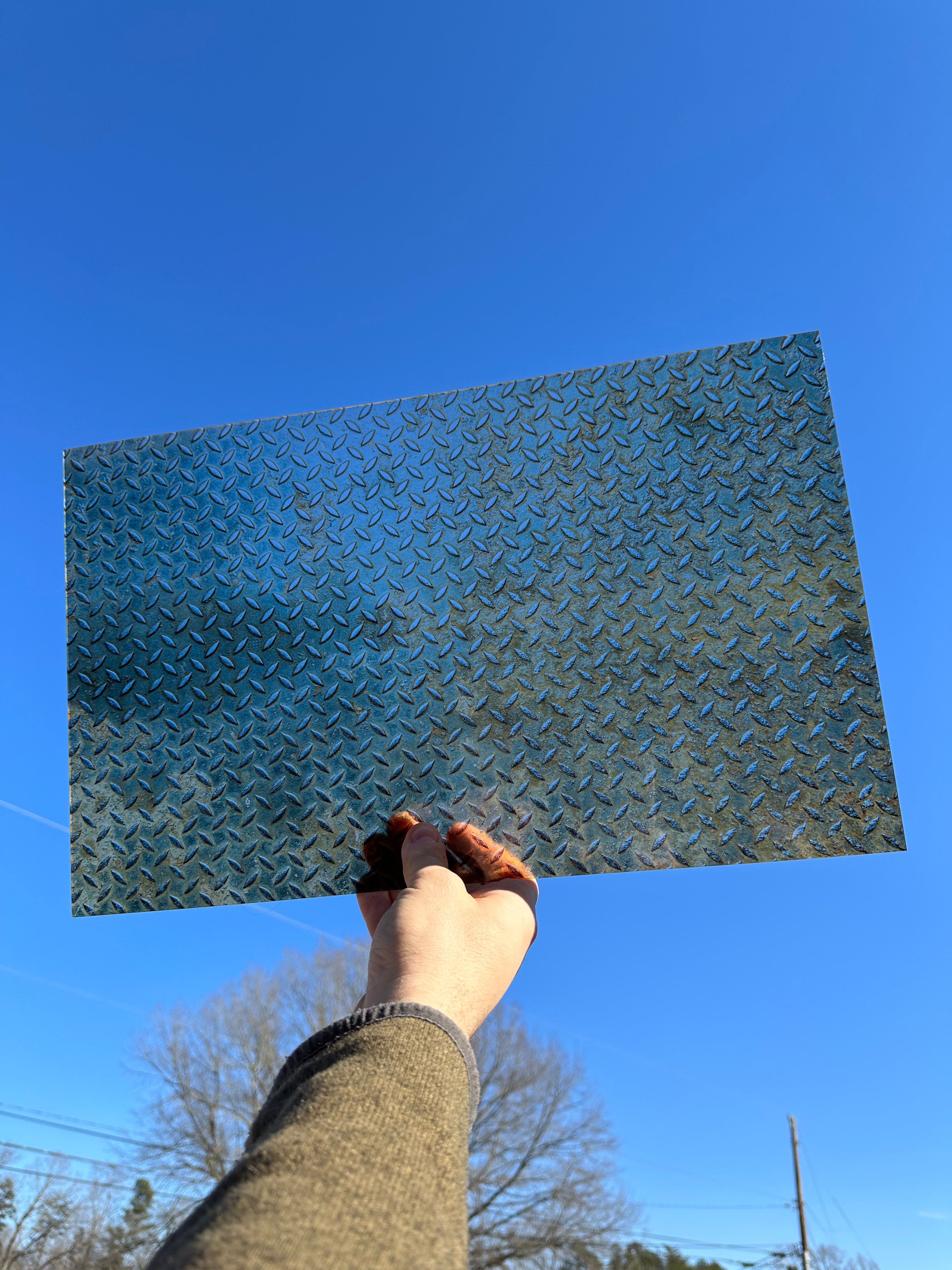 PatternPly® Transparent Rusted Diamond Plate sheet showing the pattern