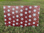 PatternPly® Full Coverage Red Snowflake Buffalo Plaid sheet showing the pattern