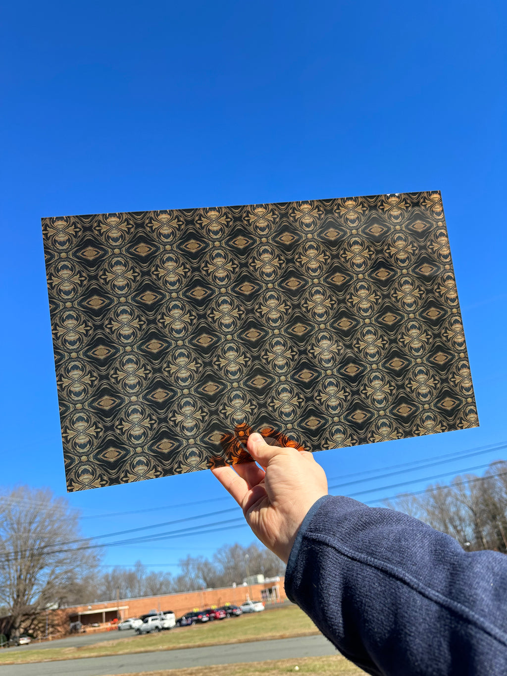 PatternPly® Transparent Black and Gold Kaleidoscope sheet showing the pattern